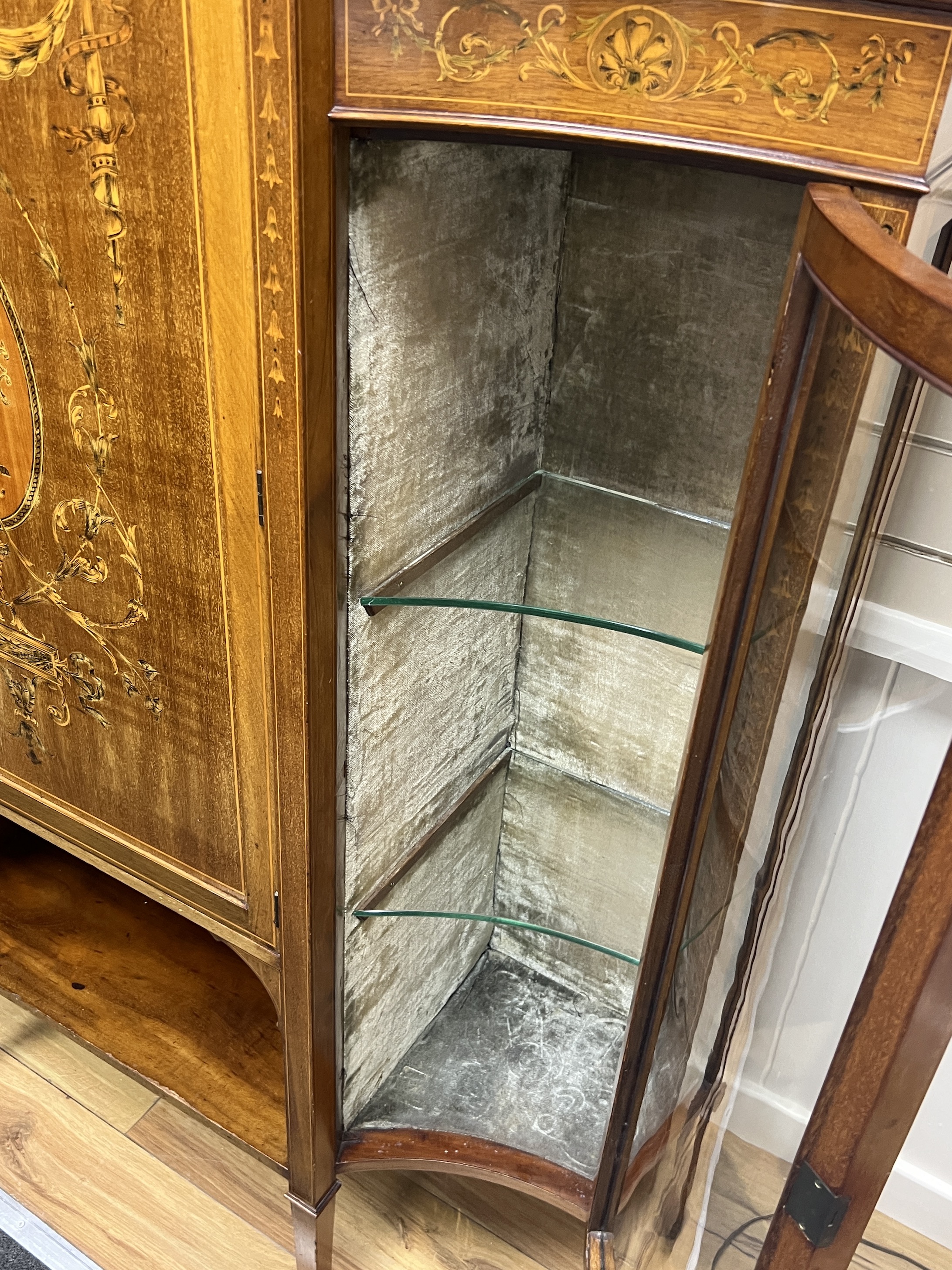 An Edwardian marquetry inlaid mahogany side cabinet, width 172cm, depth 38cm, height 177cm